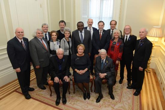 Author :Rémy Boily, Studio de Photographie et Banque d’images.   Date : 12/11/1913 From left to right and from the back: Phil Gold, Daniel Bertolino, Michel L.Tremblay, Monique Leyrac, Robert Morin, Madeleine Juneau, Maka Kotto, ministre de la Culture et des Communications, James D. Wuest, Pierre Duchesne, ministre de l'Enseignement supérieur, de la Recherche, de la Science et de la Technologie, Marcel Fournier, Marguerite Mendell, Roger Des Roches, Roger Lecomte, Marcel Barbeau, Pauline Marois, première ministre du Québec, Paul Gérin-Lajoie.